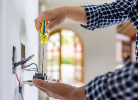 Electrician troubleshooting and repairing home wiring