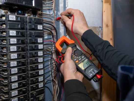 Electrician testing a 200-amp electrical panel during an upgrade